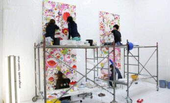 Artist assistants working on piece