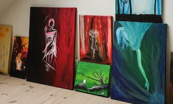 A collection of various artwork in a bright room