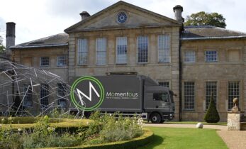 Momentous Transportation outside a house