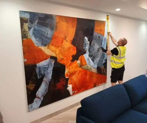 Momentous Relocation worker measuring a piece of artwork.